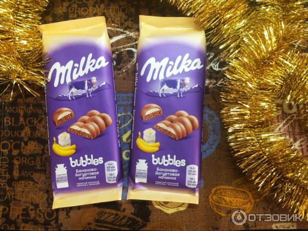 Шоколад молочный пористый Milka Bubbles с бананово-йогуртовой начинкой фото